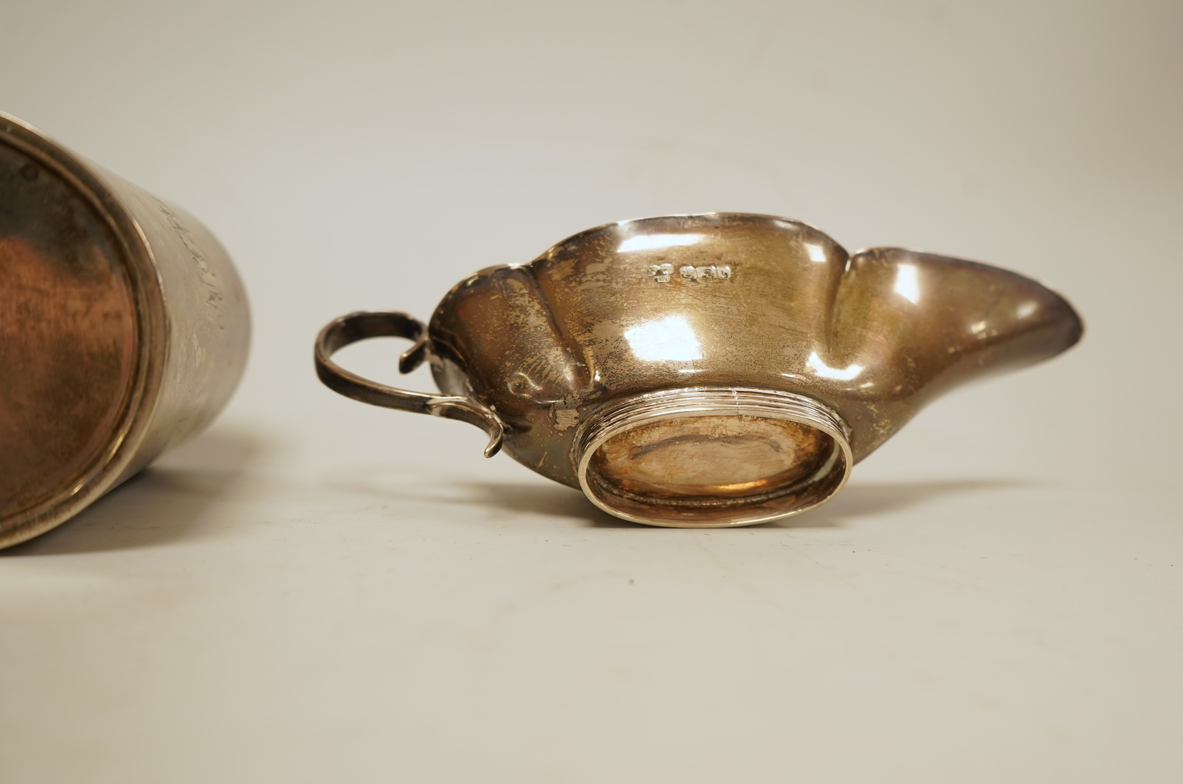 A late Victorian silver christening mug by Aldwinckle & Slater, London, 1893, height 71mm, together with a small silver sauceboat, 5oz.